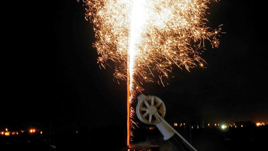 A firework display reflected in the Conwy Estuary at night