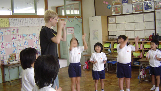 Children taking part in a head, shoulders, knees and toes activity