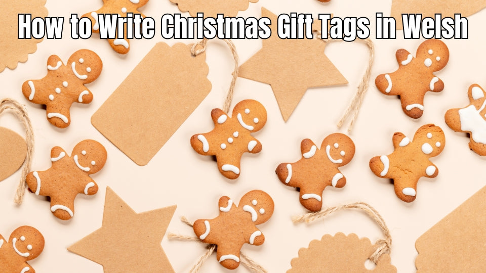 Welsh-language Christmas gift tags on wrapped presents.