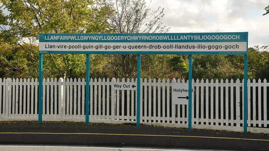 Long Welsh place name displayed on the sign at Llanfairpwll railway station