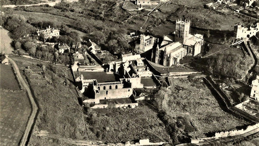 A historic aerial view of St Davids Cathedral and the small city around it