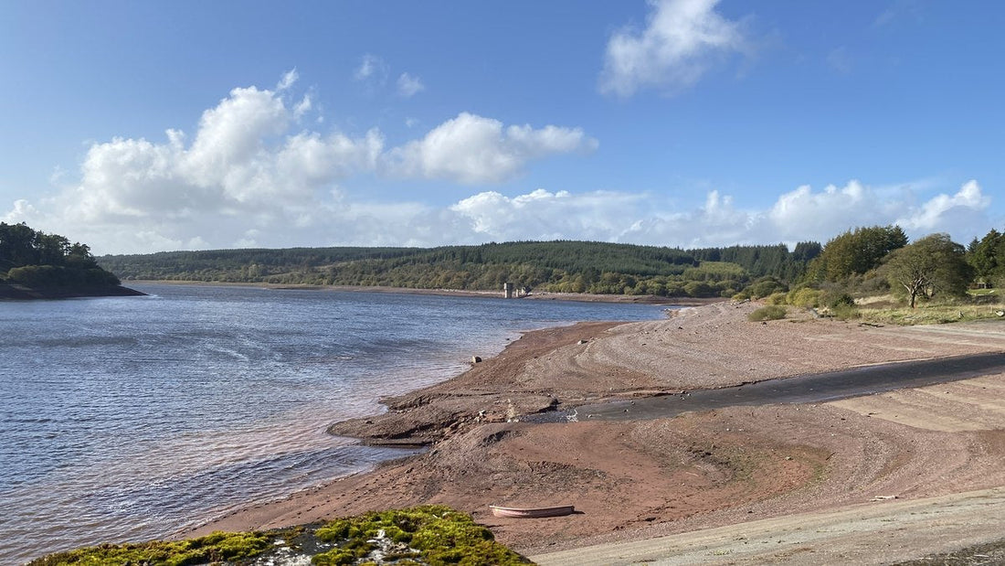 Low water and exposed banks at Usk Reservoir after drought