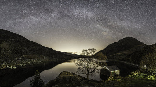 The Milky Way over Llyn Ogwen in Eryri at night.