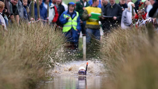 A competitor racing through the bog trench at the World Bog Snorkelling Championships